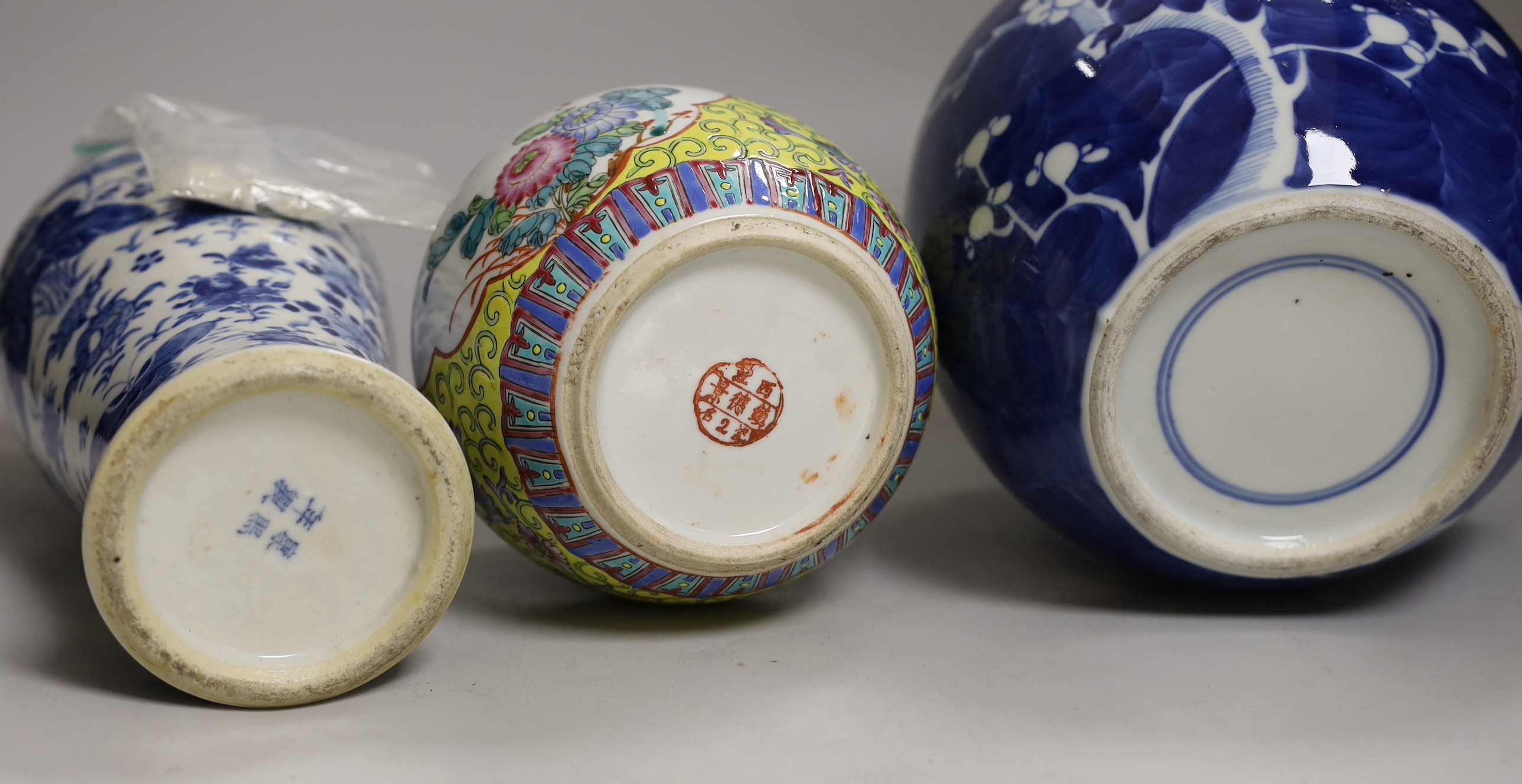 A 19th century Chinese blue and white ‘birds and flowers’ baluster vase, a blue and white jar and a famille rose jar